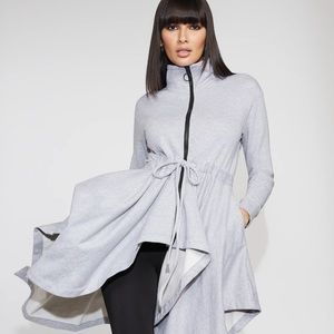 Zip up sweatshirt with handkerchief hem.